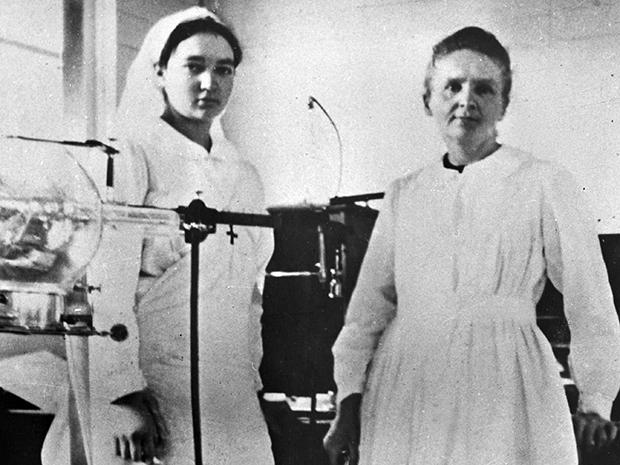 Marie Curie [right] and her teenage daughter, Irène, operated the "Petite Curies" and established a program to train other women to use the X-ray equipment.